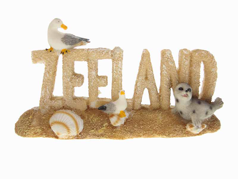 Woord ZEELAND met meeuw en zeehond